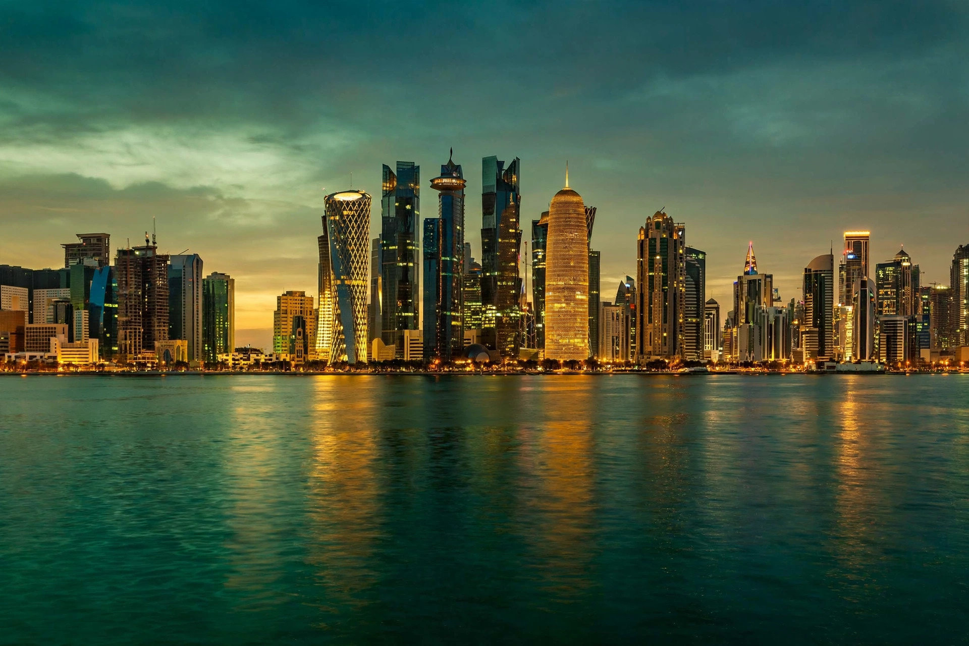 Doha skyline at dusk across the water, representing Qatar freelance and family visa routes